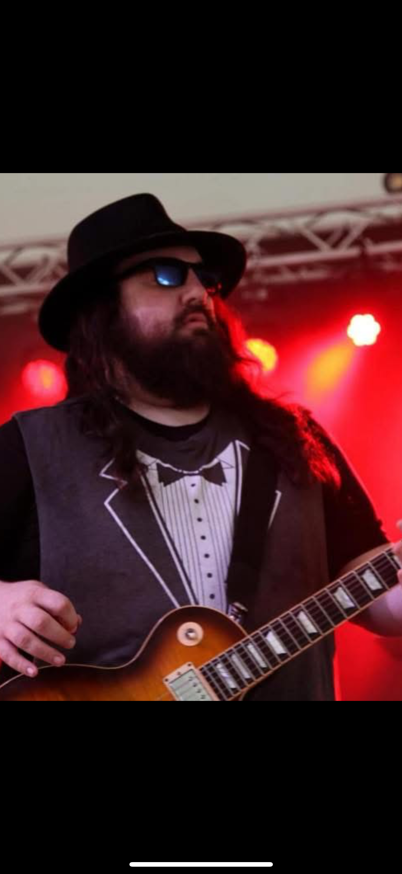 Taylor Davis on stage with his guitar